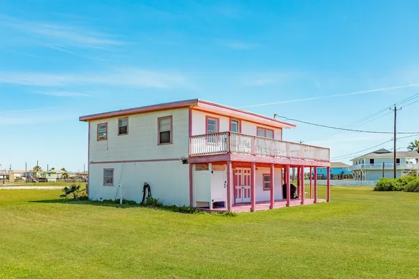 a view of an apartment with a swimming pool