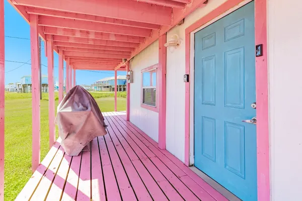a living room with furniture a flat screen tv and a window