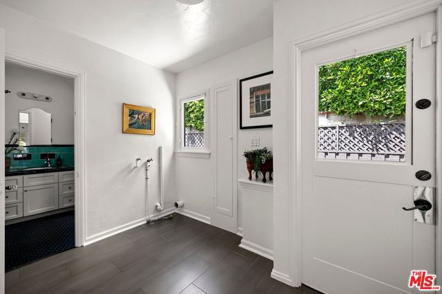 a view of an entryway with wooden floor and windows