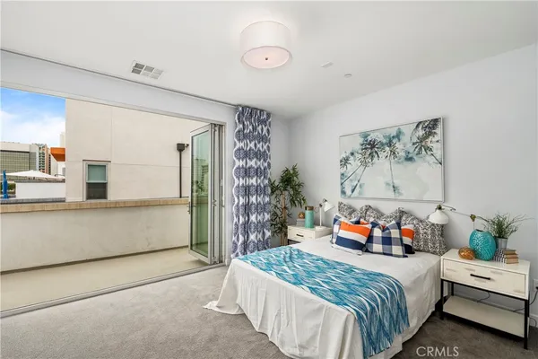 a bedroom with bed and window