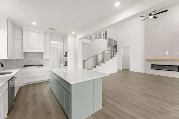 a kitchen with a sink and a refrigerator