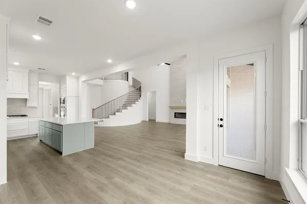 a view of kitchen with furniture and wooden floor