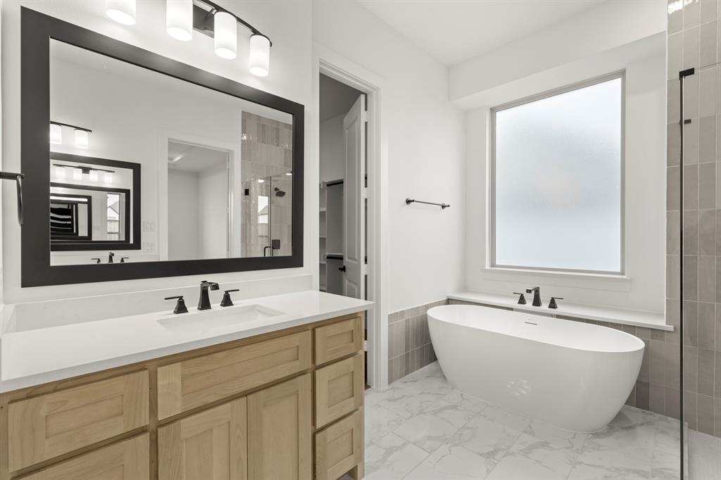 1061 Georgetown Place Prosper, TX 75078 - Photo 19 of 29 a bathroom with a double vanity sink mirror and double