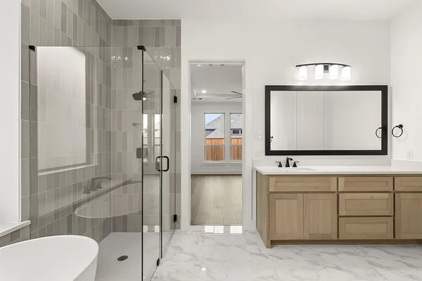 a bathroom with a toilet a sink and shower
