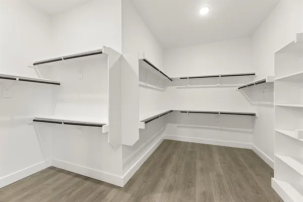 a view of an empty walk in closet