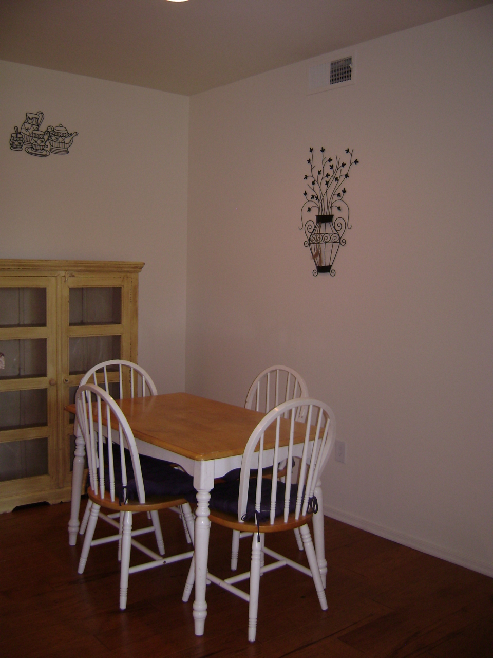 3302 North 7th Street, Unit 135 Phoenix, AZ 85014 - Photo 3 of 6 a view of a dining room with furniture and wooden floor