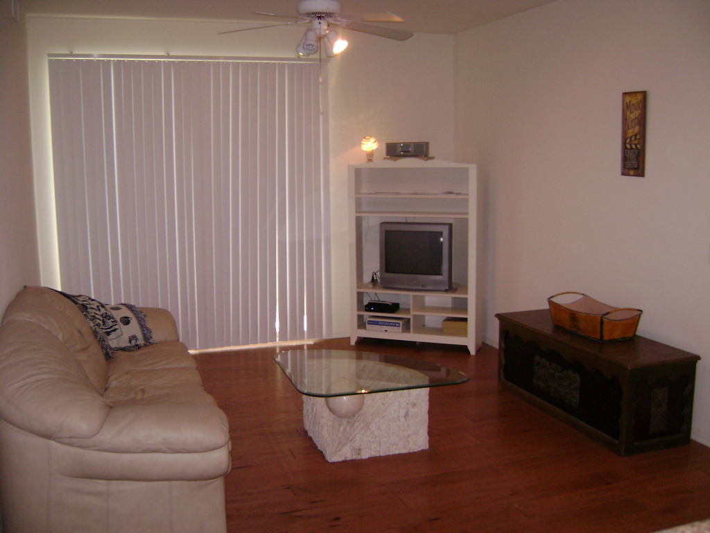 3302 North 7th Street, Unit 135 Phoenix, AZ 85014 - Photo 4 of 6 a living room with furniture and a fireplace