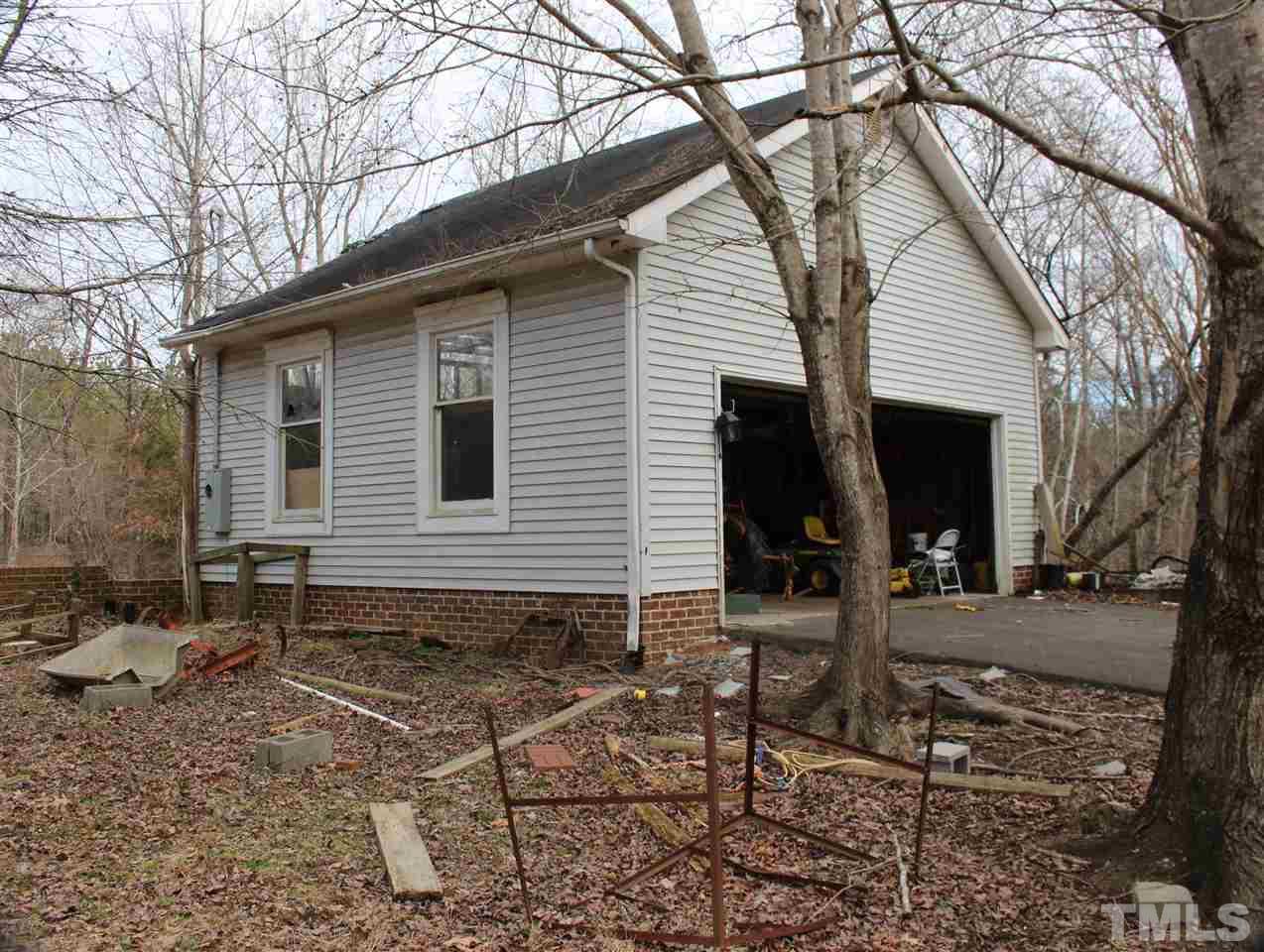 Pope Road Creedmoor, NC 27522 - Photo 5 of 16 a view of a house with yard next to a large tree