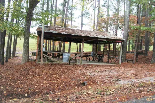 a view of a house with backyard porch and sitting area