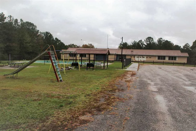 a view of a house with a park