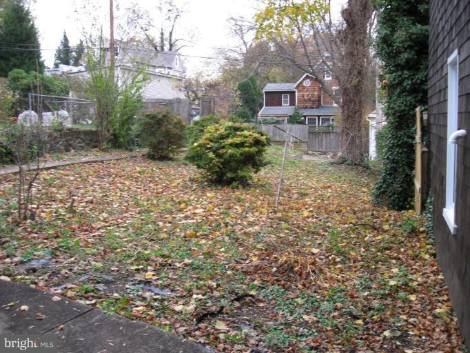 4513 Schenley Road Baltimore, MD 21210 - Photo 6 of 7 a front view of a house with a yard