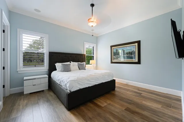 a spacious bedroom with a bed and a window