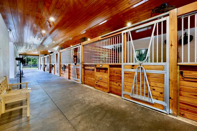 a view of a house with wooden fence