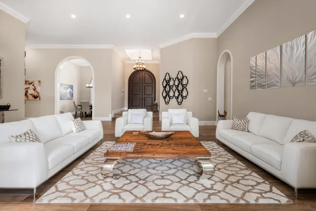 a living room with furniture and a rug
