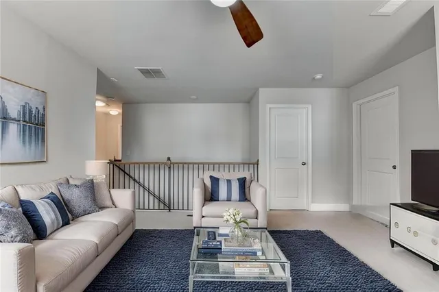 a living room with furniture and a rug