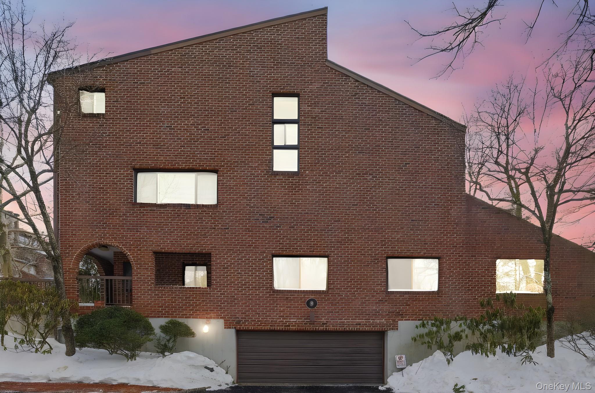 a front view of a house with yard
