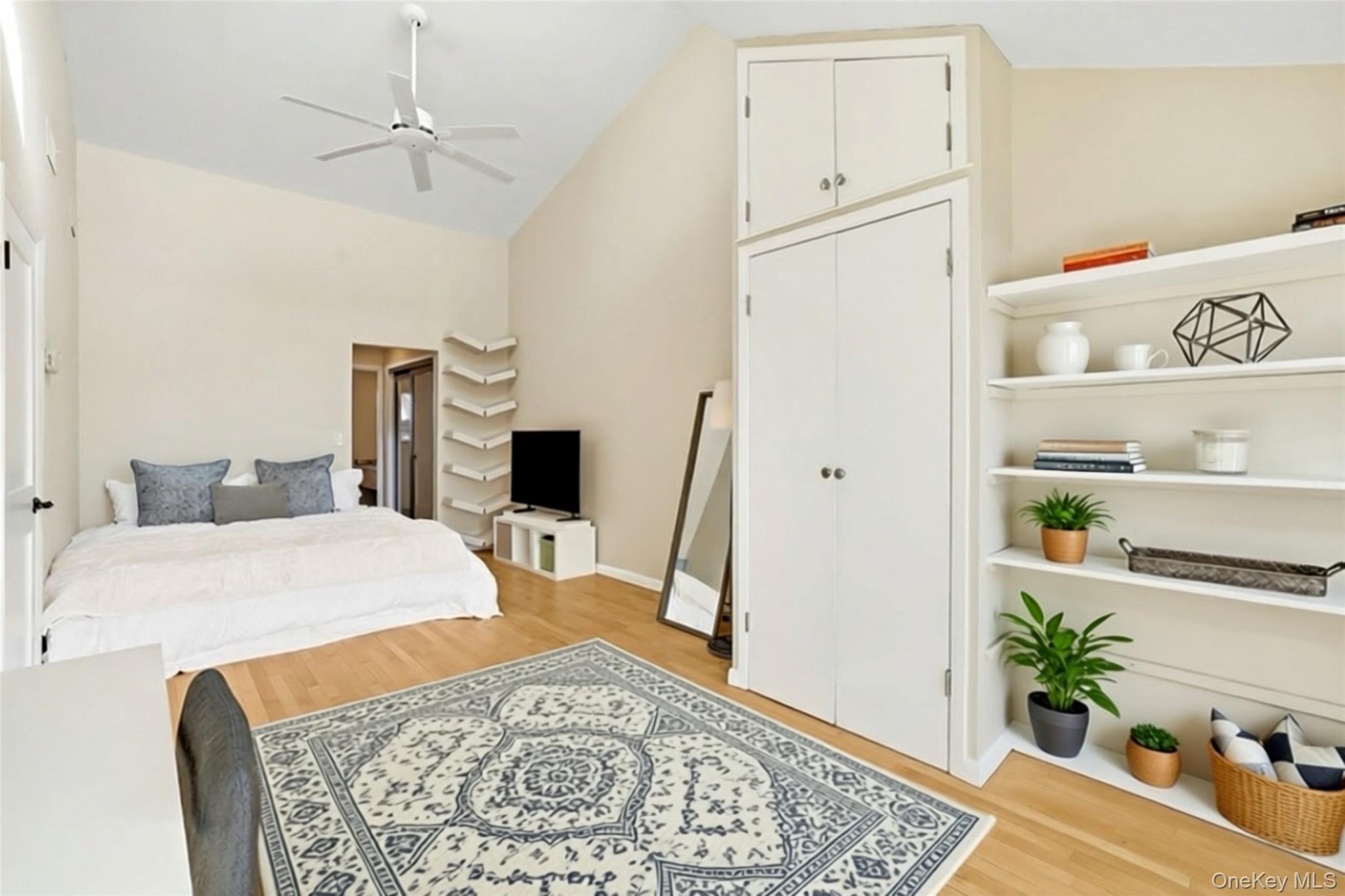 150 North Bedford Road, Unit 6D Chappaqua, NY 10514 - Photo 9 of 18 a bedroom with a bed and a dresser in it