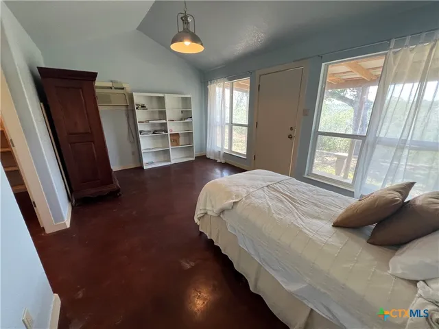 a view of a livingroom with hardwood floor and a ceiling fan