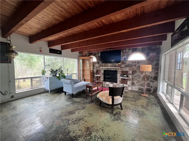 a utility room with stainless steel appliances wooden floors and view