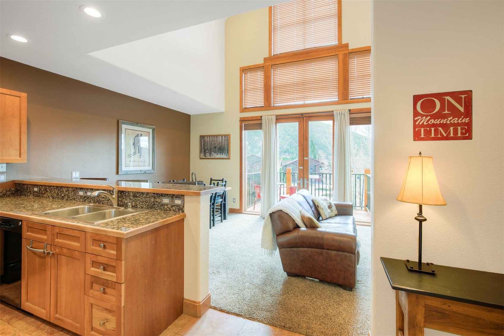 71 Antlers Gulch Road, Unit 303 Keystone, CO 80435 - Photo 10 of 35 a living room with furniture and a large window