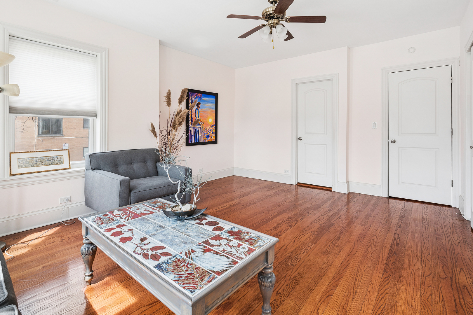 2656 West Lunt Avenue, Unit 1 Chicago, IL 60645 - Photo 6 of 12 a living room with furniture and a wooden floor