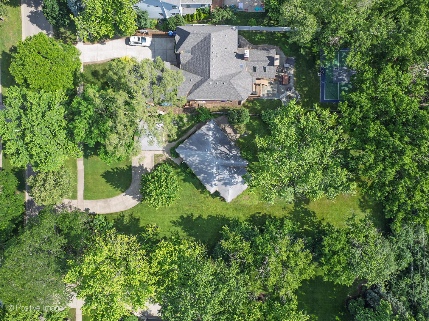 241 Coe Road Clarendon Hills, IL 60514 - Photo 11 of 12 an aerial view of a house with a yard and lake view