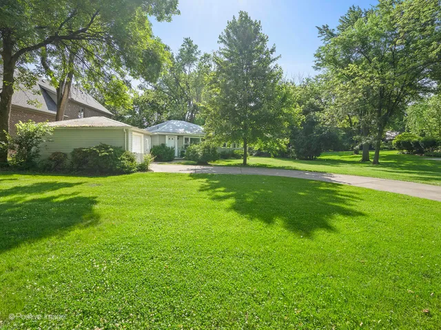 a view of a house with a big yard