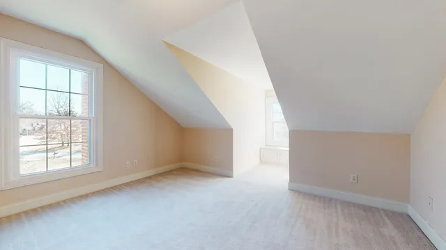 a view of a room with an entryway and hallway