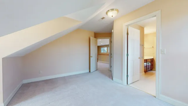 a bathroom with a tub a sink and a large mirror