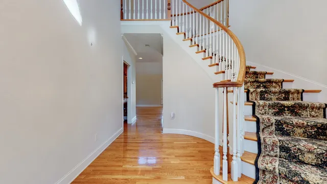 a view of entryway with wooden floor