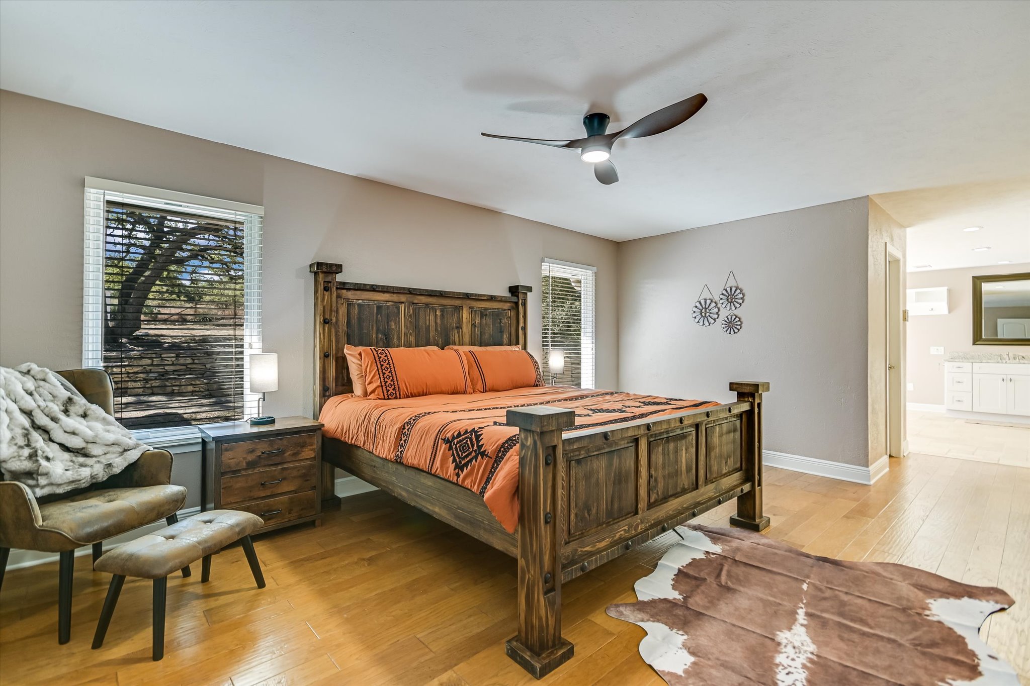 878 Ranch Road 2766 Johnson City, TX 78636 - Photo 17 of 40 a bedroom with a bed and wooden floor