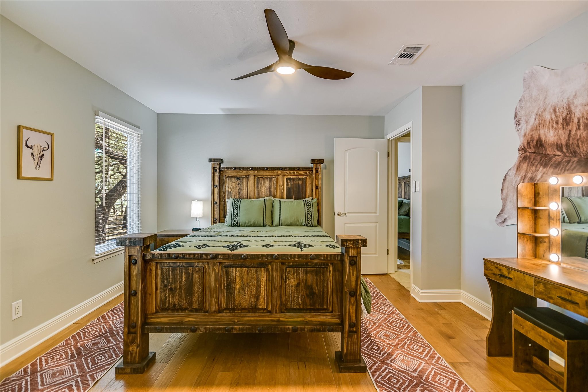 878 Ranch Road 2766 Johnson City, TX 78636 - Photo 19 of 40 a bedroom with a bed and a table in it