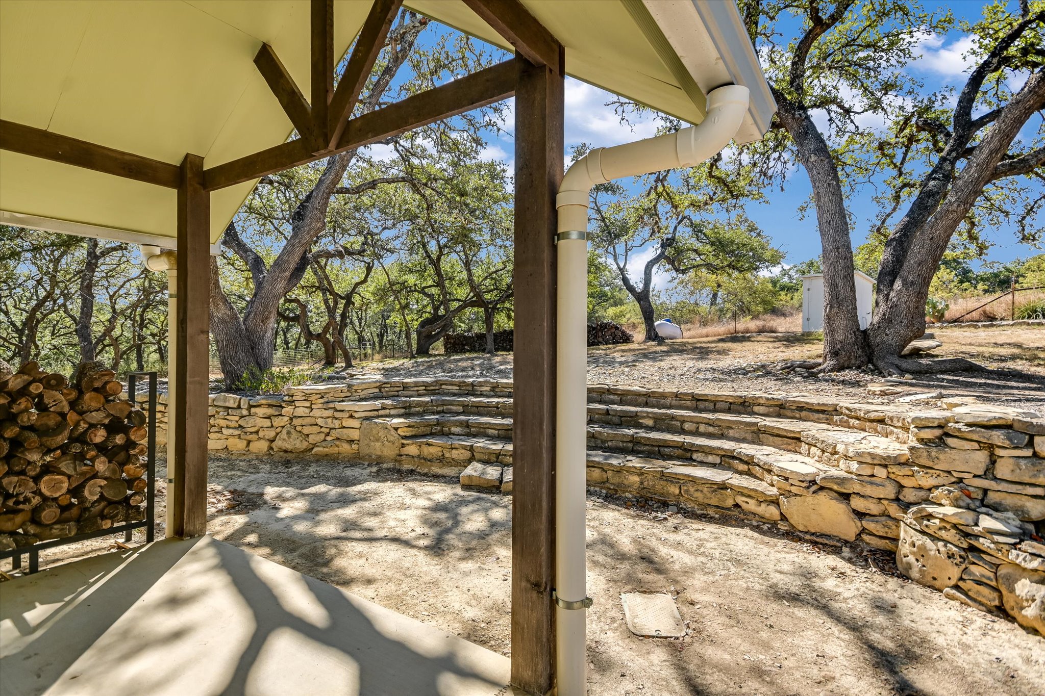 878 Ranch Road 2766 Johnson City, TX 78636 - Photo 21 of 40 a view of a backyard of the house