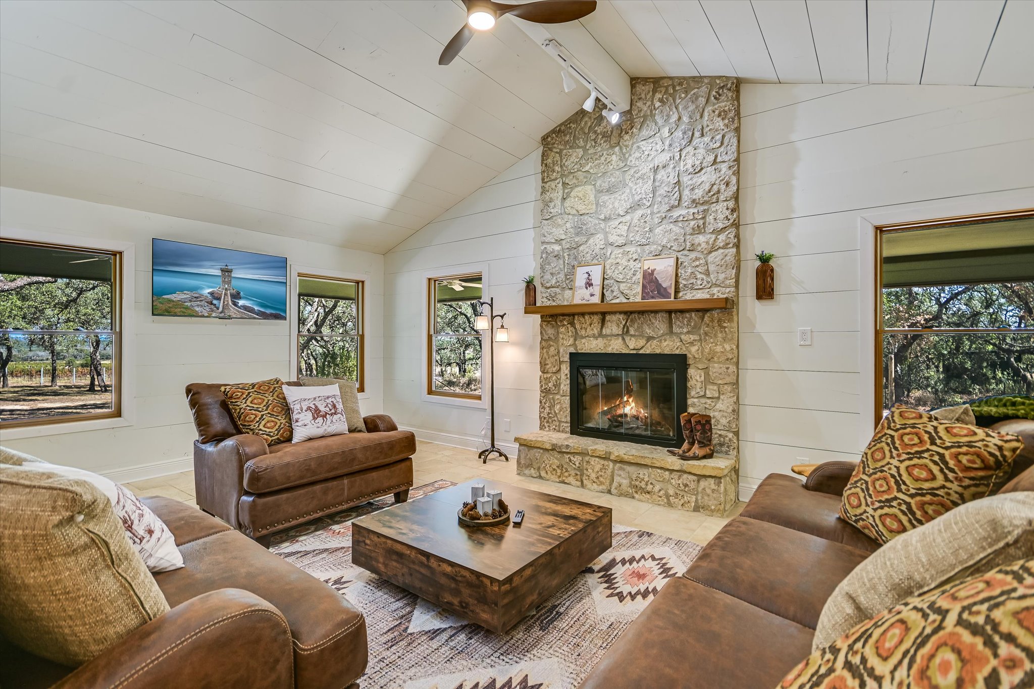 878 Ranch Road 2766 Johnson City, TX 78636 - Photo 10 of 40 a living room with furniture and a fireplace