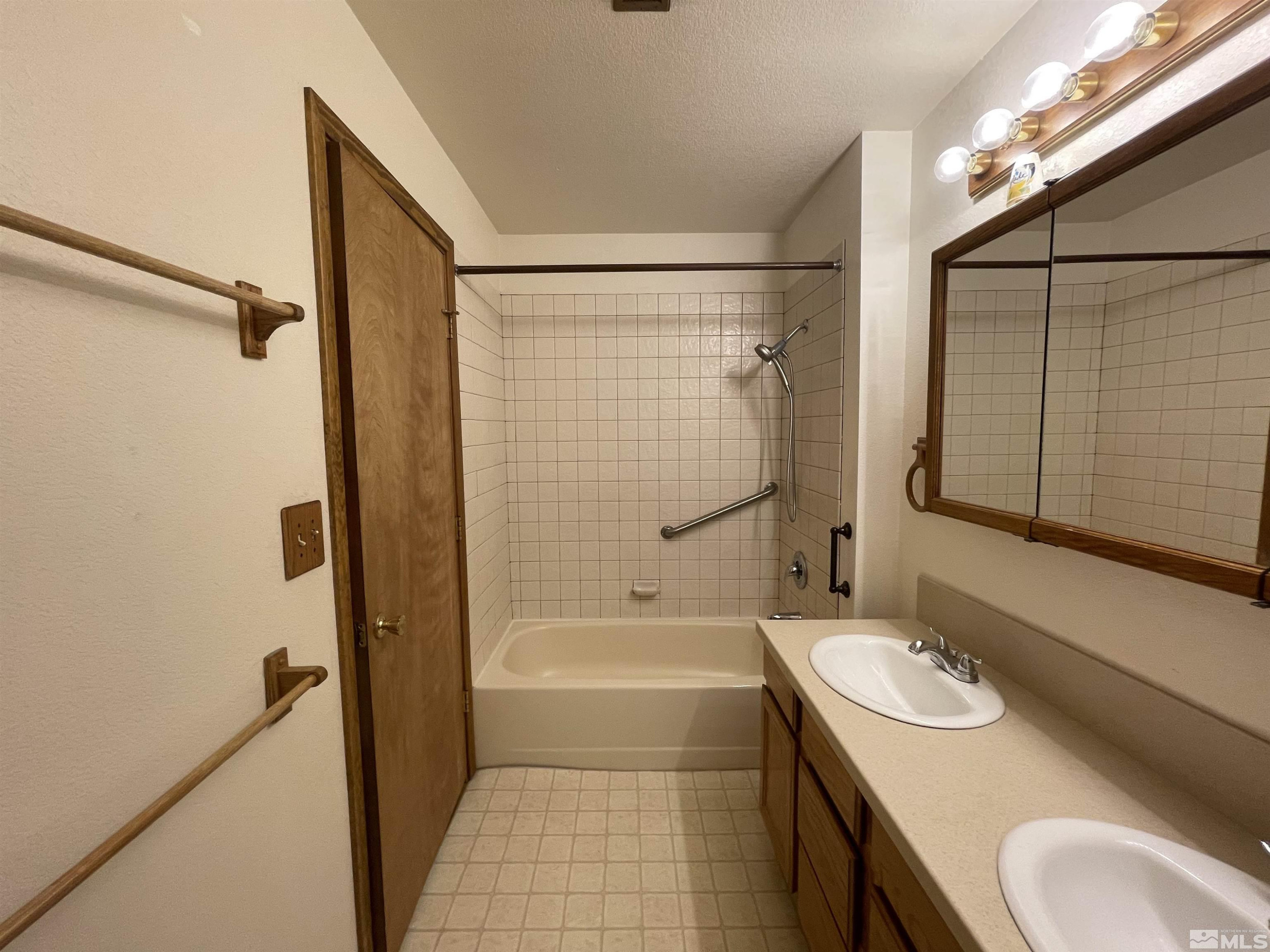 2500 Bryce Canyon Lane Reno, NV 89509 - Photo 16 of 23 a bathroom with a granite countertop sink toilet and shower