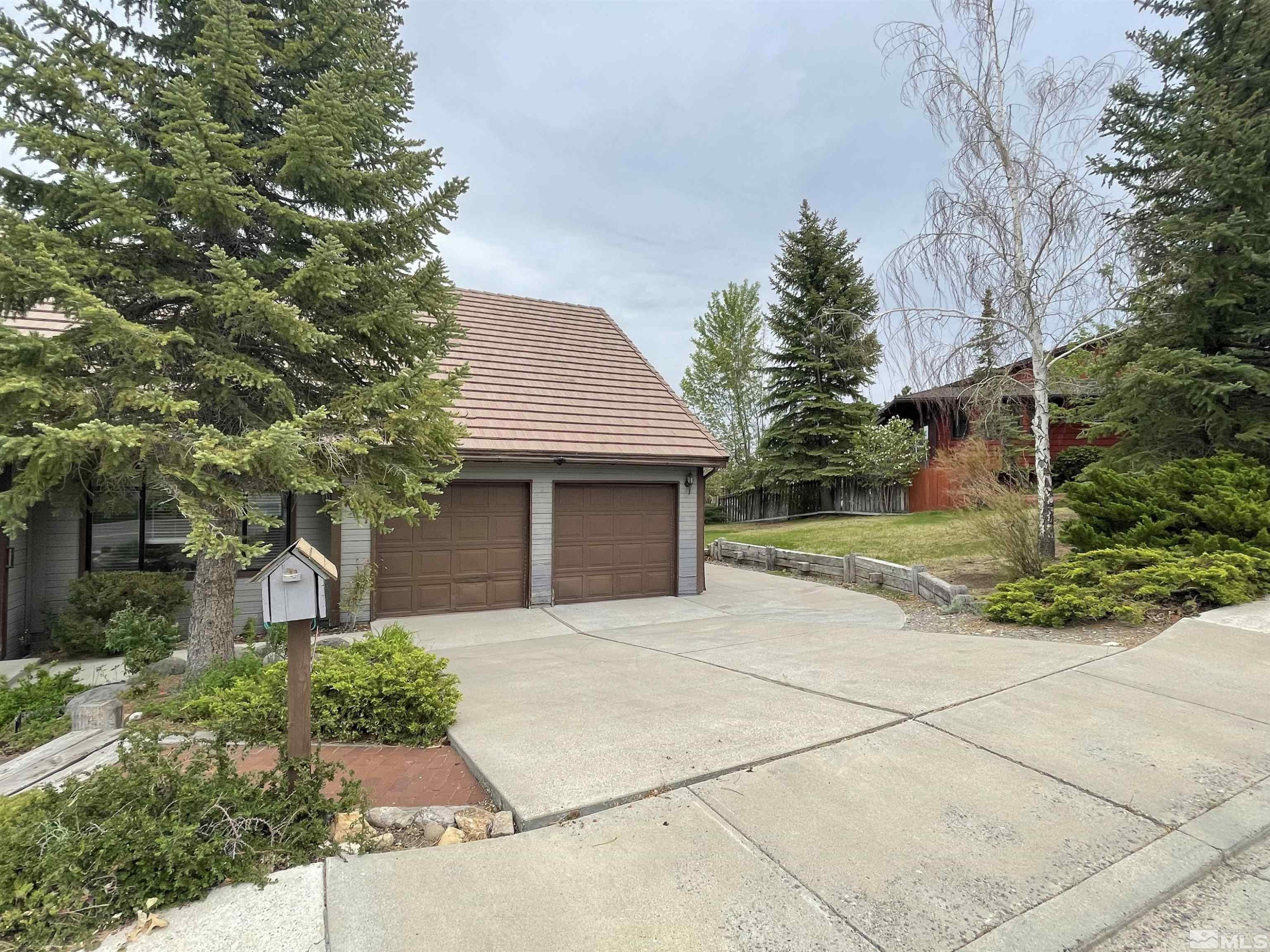2500 Bryce Canyon Lane Reno, NV 89509 - Photo 3 of 23 a front view of a house with a garden