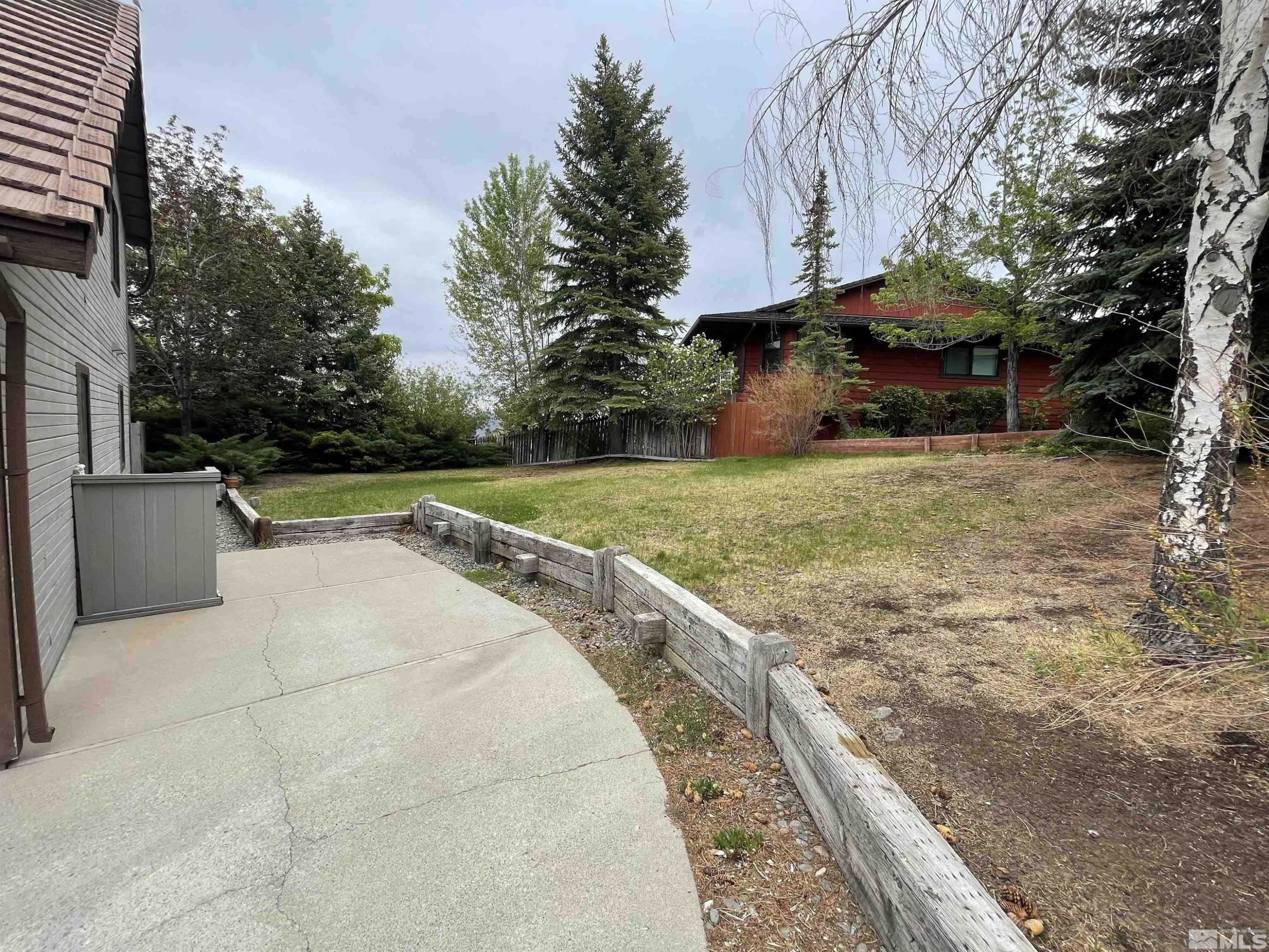 2500 Bryce Canyon Lane Reno, NV 89509 - Photo 4 of 23 a view of a backyard with large trees