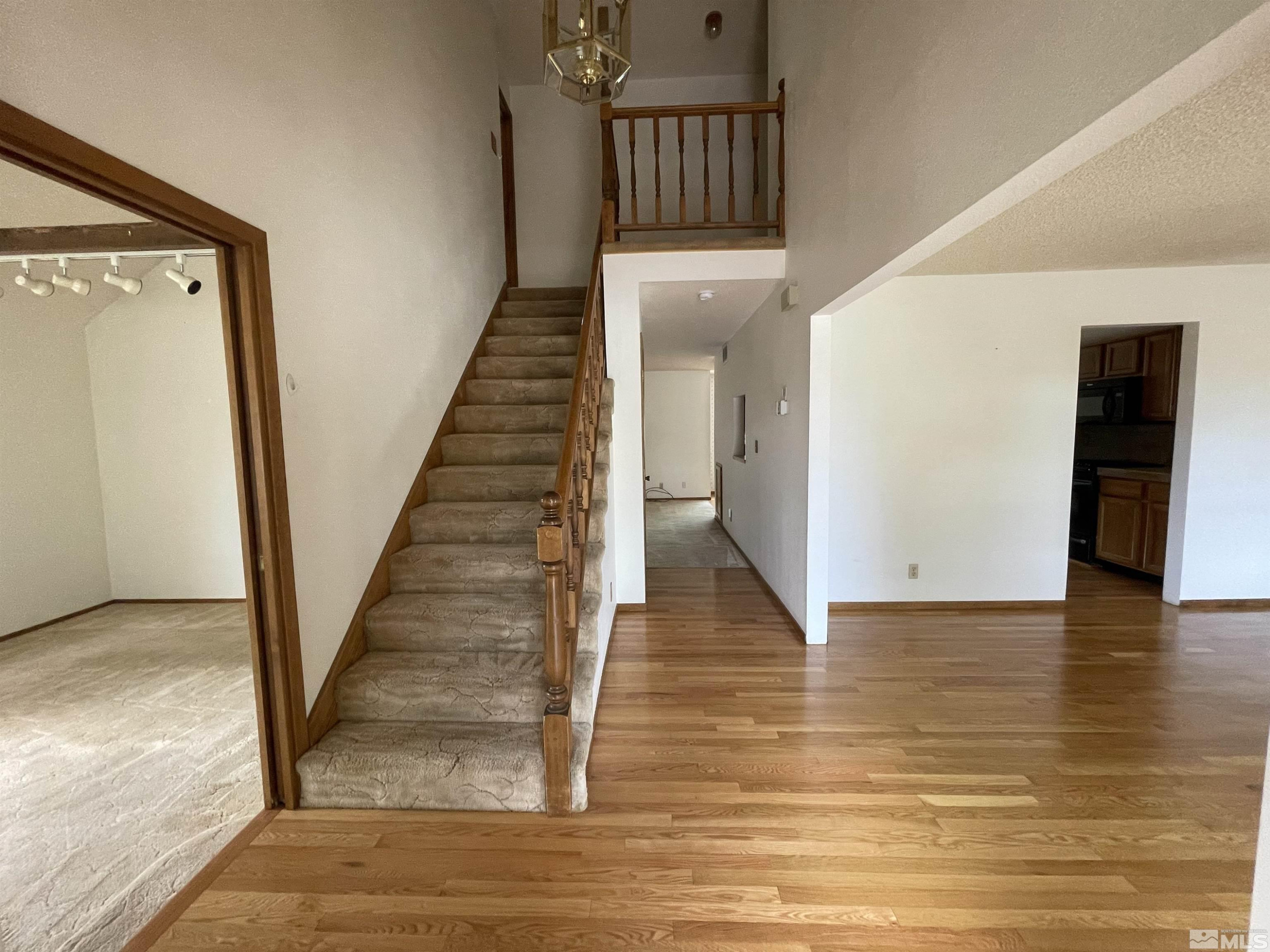 2500 Bryce Canyon Lane Reno, NV 89509 - Photo 6 of 23 a view of staircase with white walls and railing