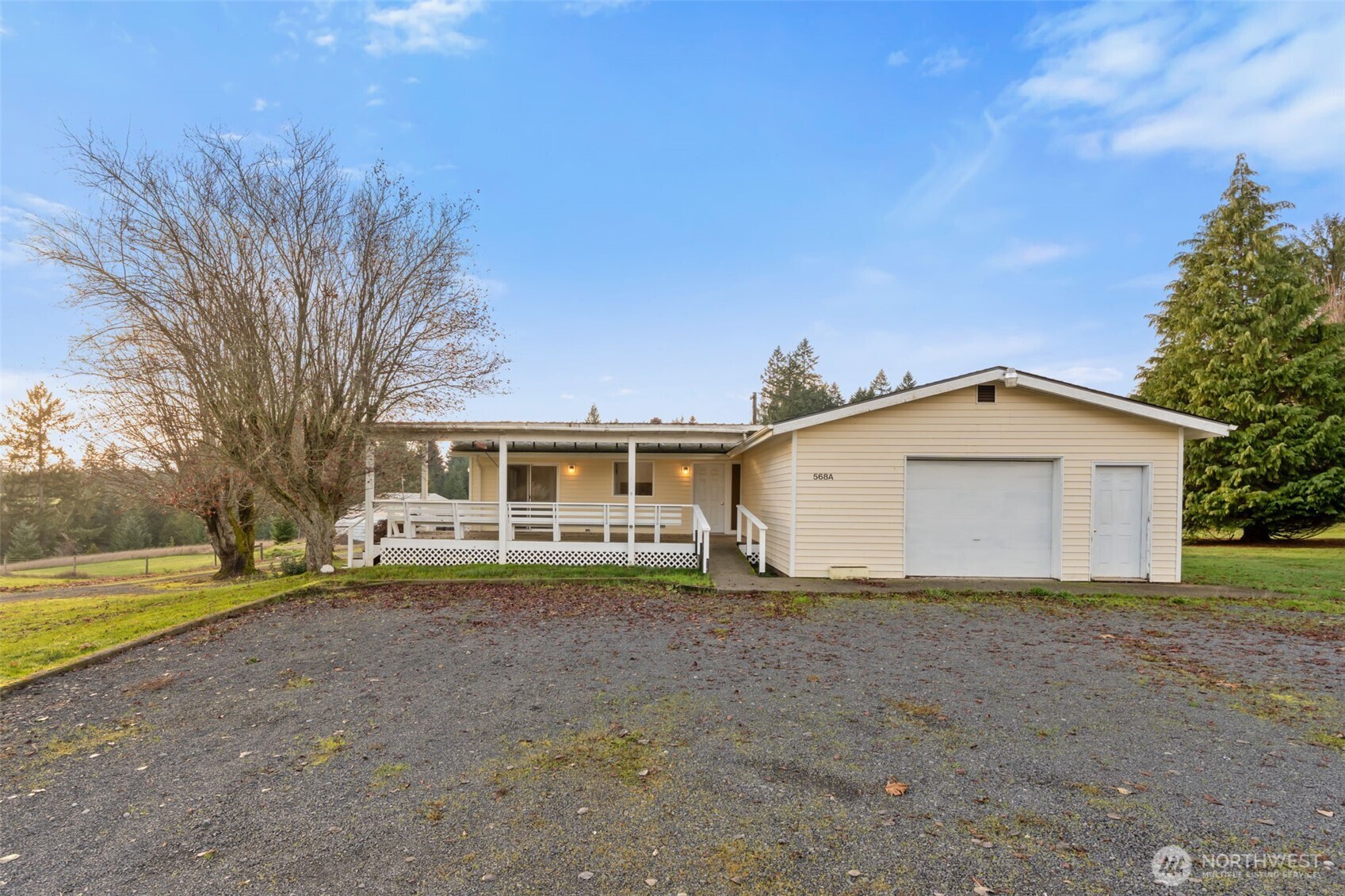568 A Cemetery Road Winlock, WA 98596 - Photo 3 of 38 a view of a house with a yard and large tree