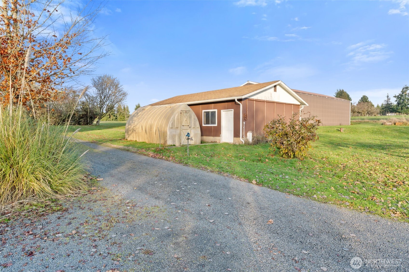 568 A Cemetery Road Winlock, WA 98596 - Photo 33 of 38 a view of a house with a yard and a large tree