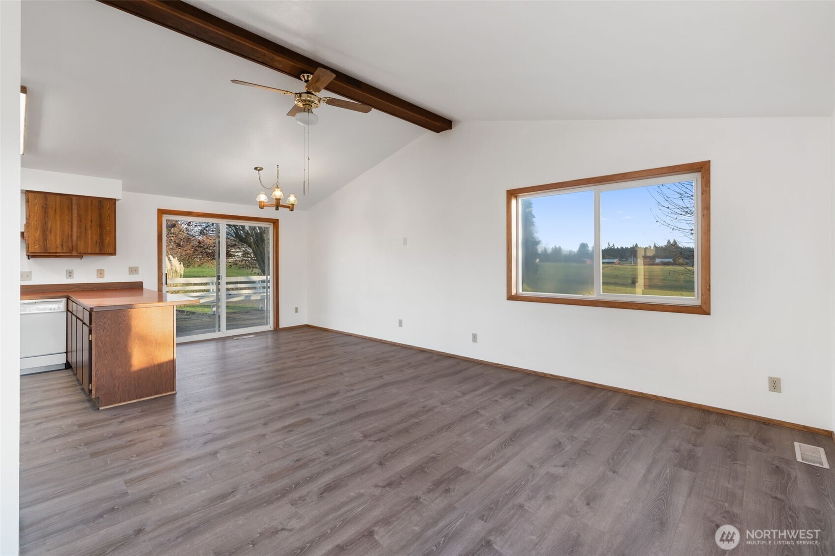 568 A Cemetery Road Winlock, WA 98596 - Photo 10 of 38 a view of an empty room with wooden floor and a window