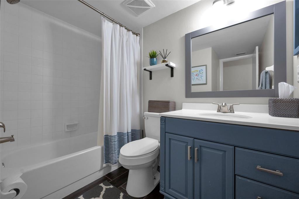 208 Caryl Way Oldsmar, FL 34677 - Photo 21 of 28 a bathroom with a sink toilet a shower and a mirror