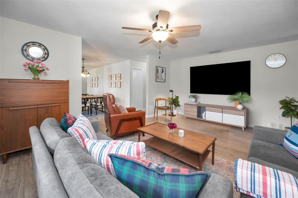 208 Caryl Way Oldsmar, FL 34677 - Photo 6 of 28 a living room with furniture and a flat screen tv