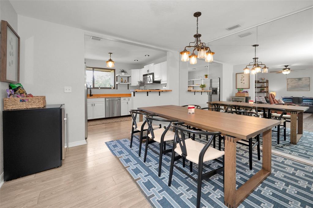 208 Caryl Way Oldsmar, FL 34677 - Photo 10 of 28 a view of a dining room with furniture and wooden floor