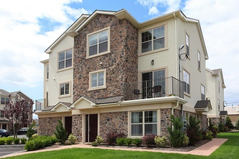 1625 Paterson Plank Road, Unit 24 Secaucus, NJ 07094 - Photo 1 of 20 a front view of a house with garden