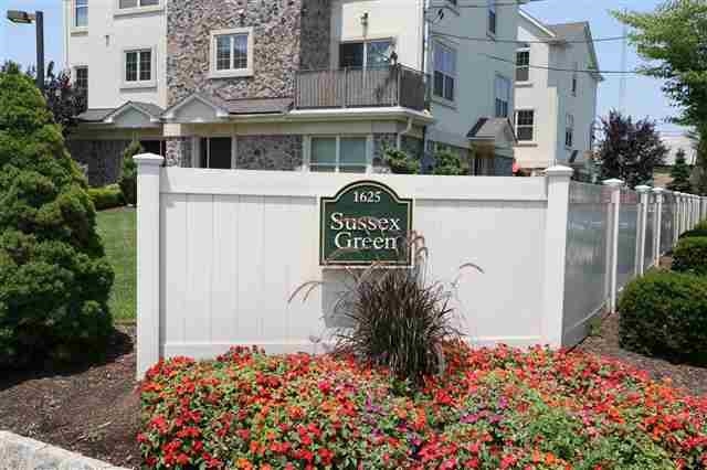 1625 Paterson Plank Road, Unit 24 Secaucus, NJ 07094 - Photo 20 of 20 a front view of a house with a yard and fountain
