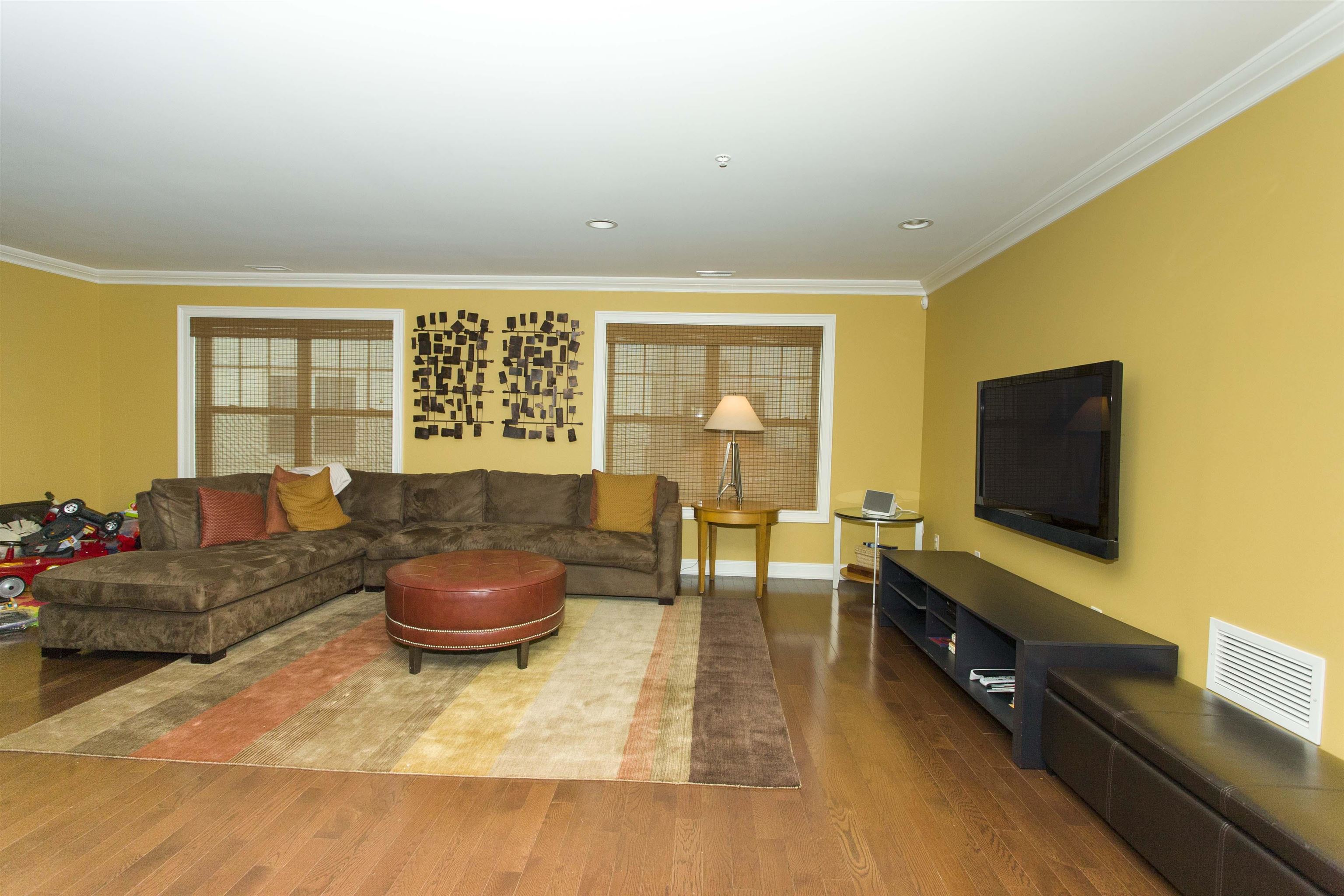 1625 Paterson Plank Road, Unit 24 Secaucus, NJ 07094 - Photo 3 of 20 a living room with furniture and a flat screen tv