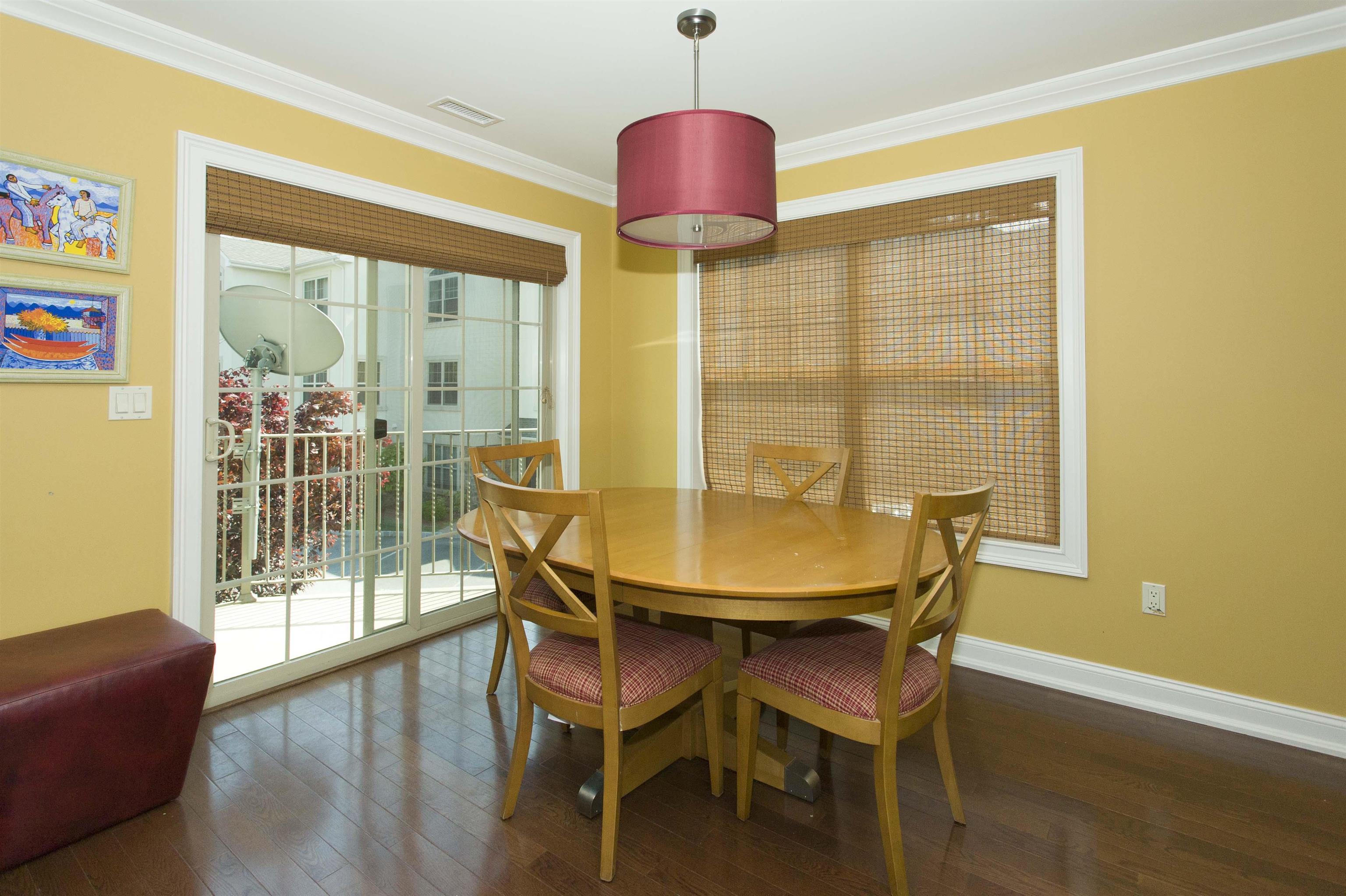 1625 Paterson Plank Road, Unit 24 Secaucus, NJ 07094 - Photo 6 of 20 a view of a dining room with furniture and wooden floor