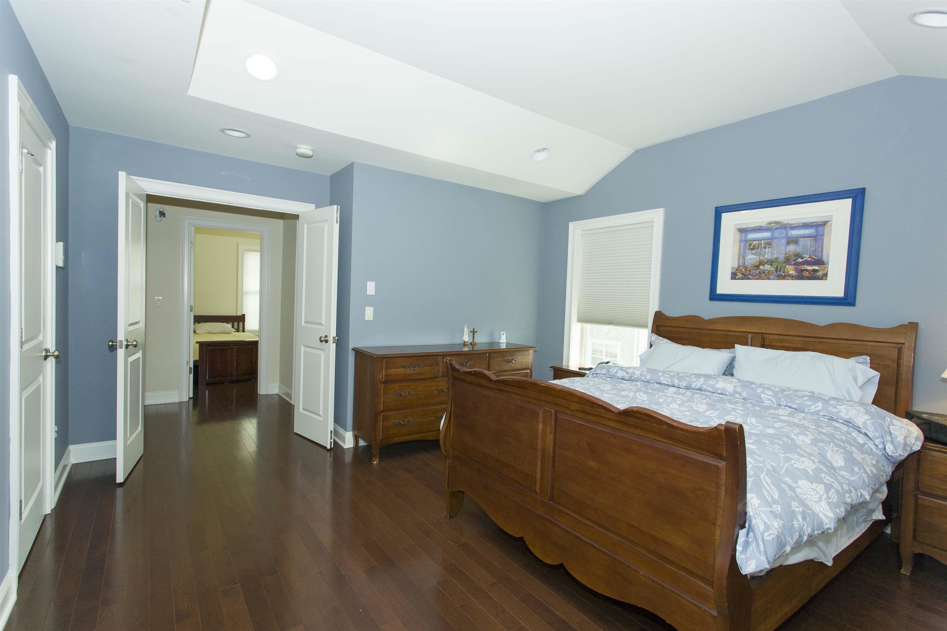 1625 Paterson Plank Road, Unit 24 Secaucus, NJ 07094 - Photo 10 of 20 a bedroom with a bed and a painting