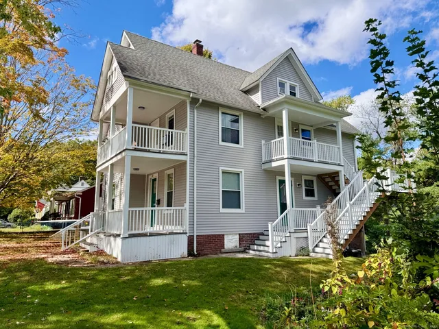 a front view of a house with a yard